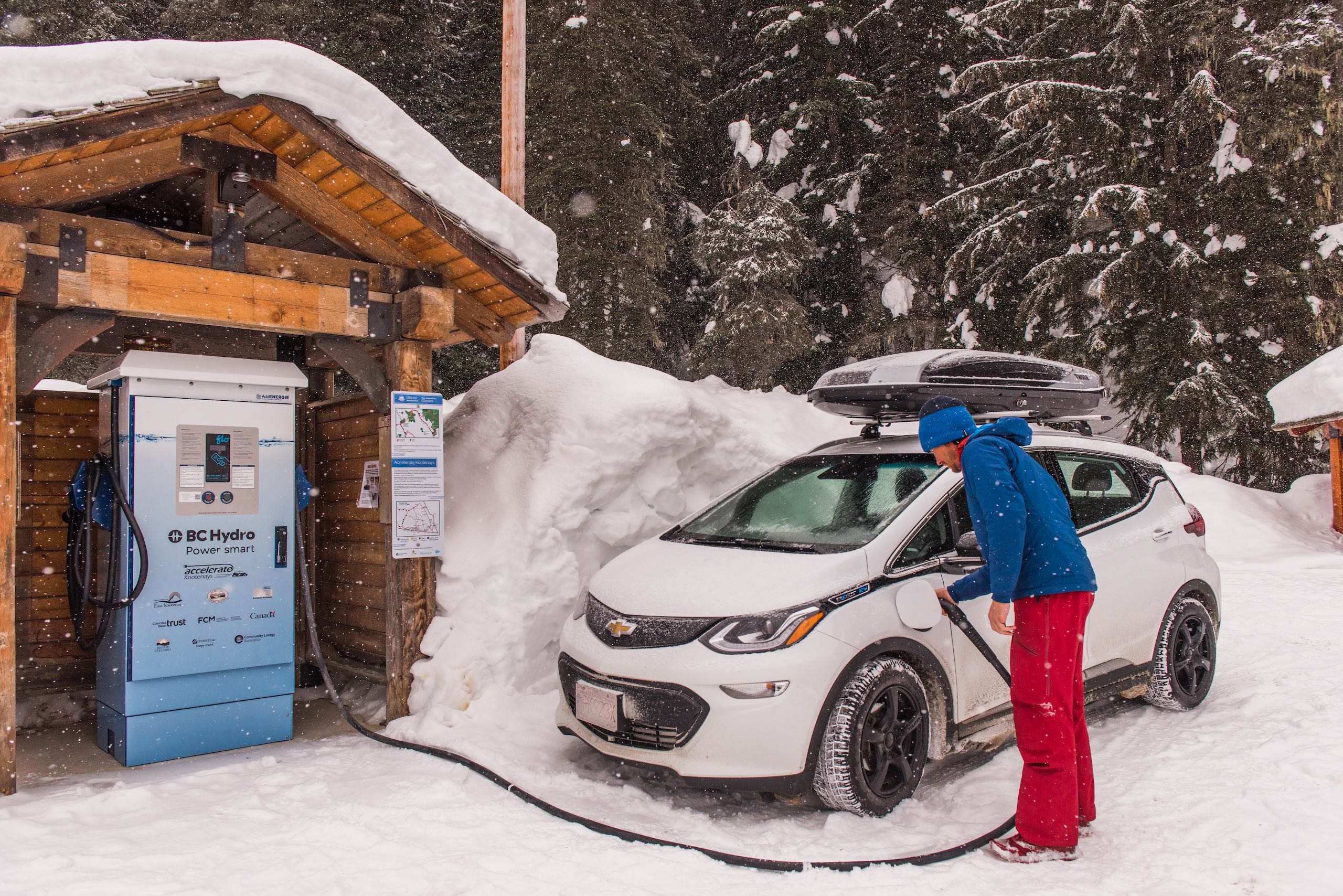 Person plugging in his electric car at Rogers Pass.