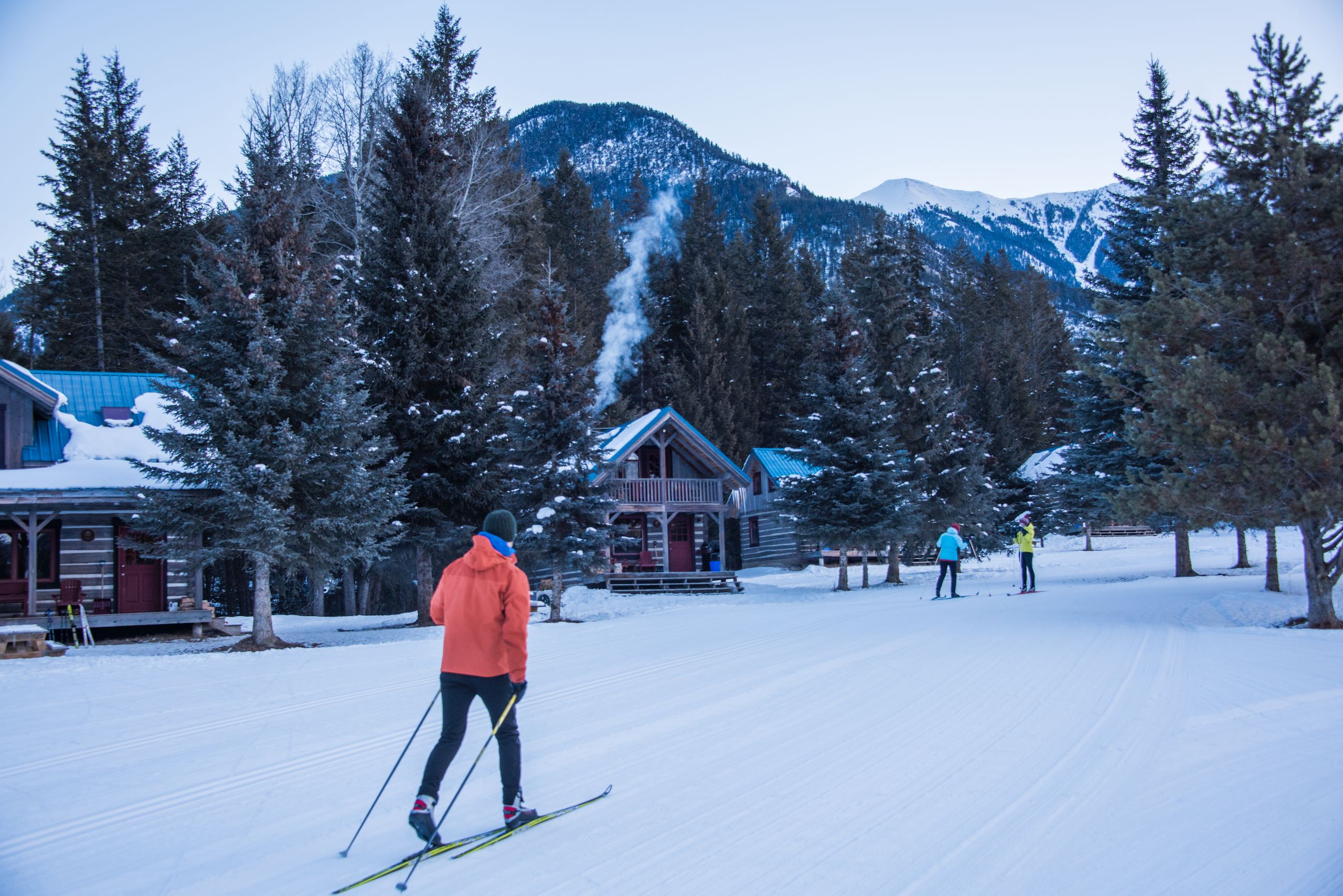Cross-country skiing at Nipika Mountain Resort with the cabins in the background.