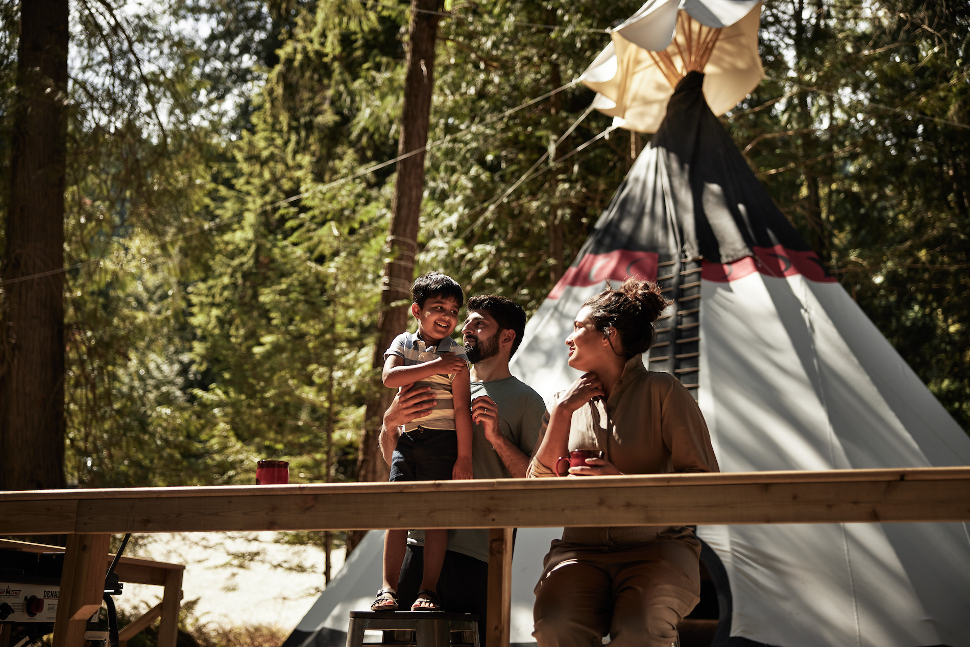 A young family enjoying a stay at the Fraser Canyon Teepee Escape and Great River Fishing Adventures