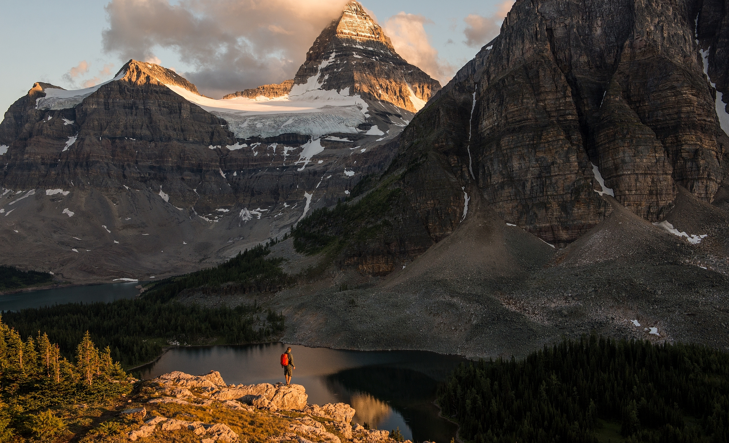 A person standing in front of a large mountain in BC, Canada