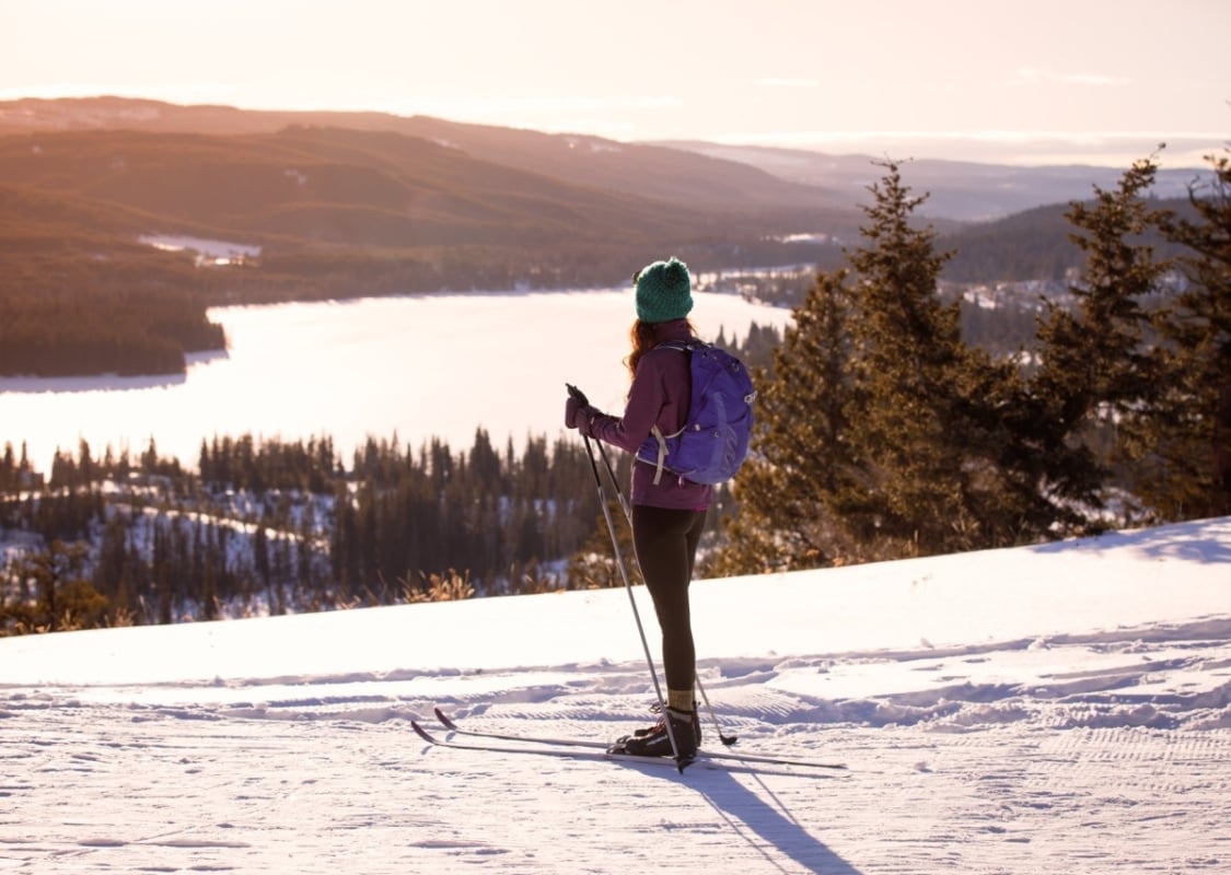 Person Nordic skiing at Stake Lake near Kamloops, looking out over the lake | Tamra Jaeger