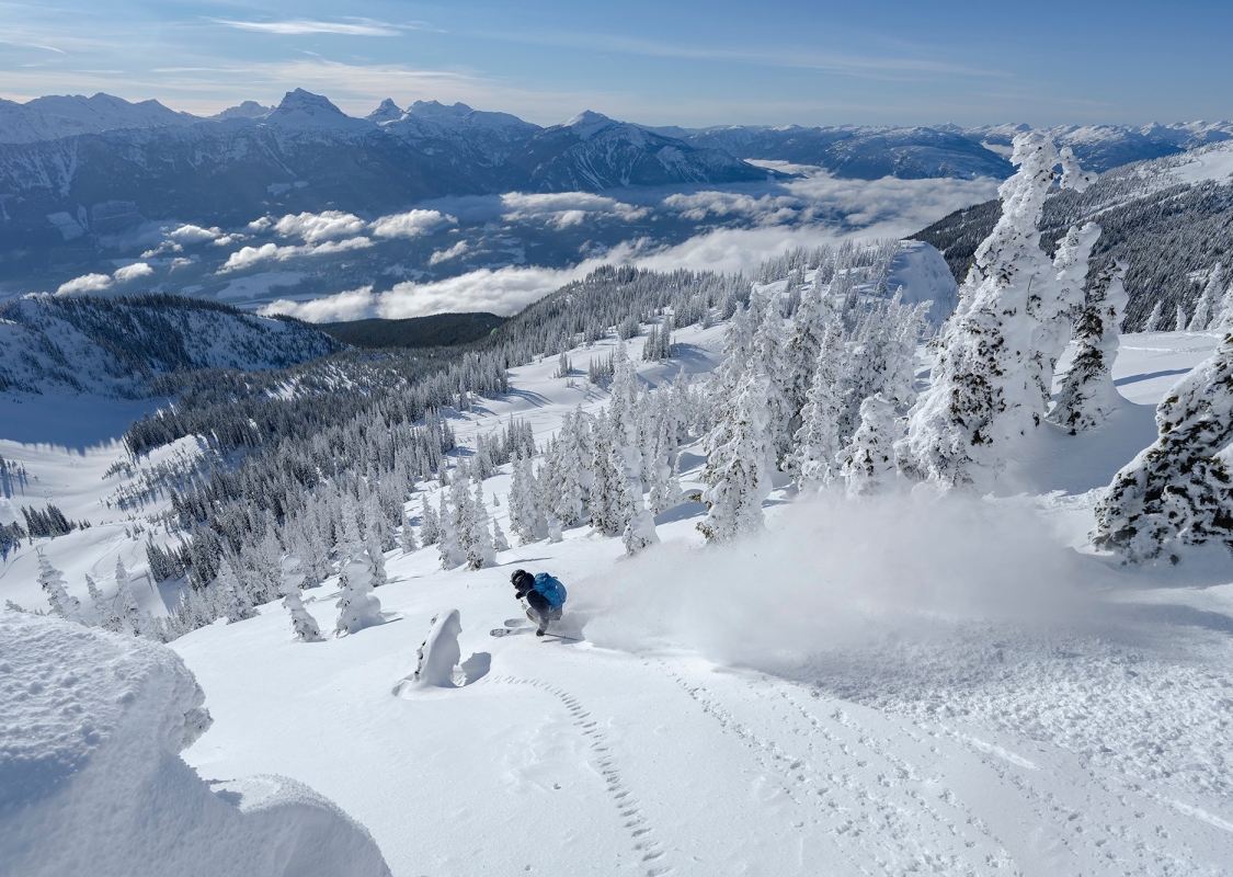 A person skiing down a snowy mountain