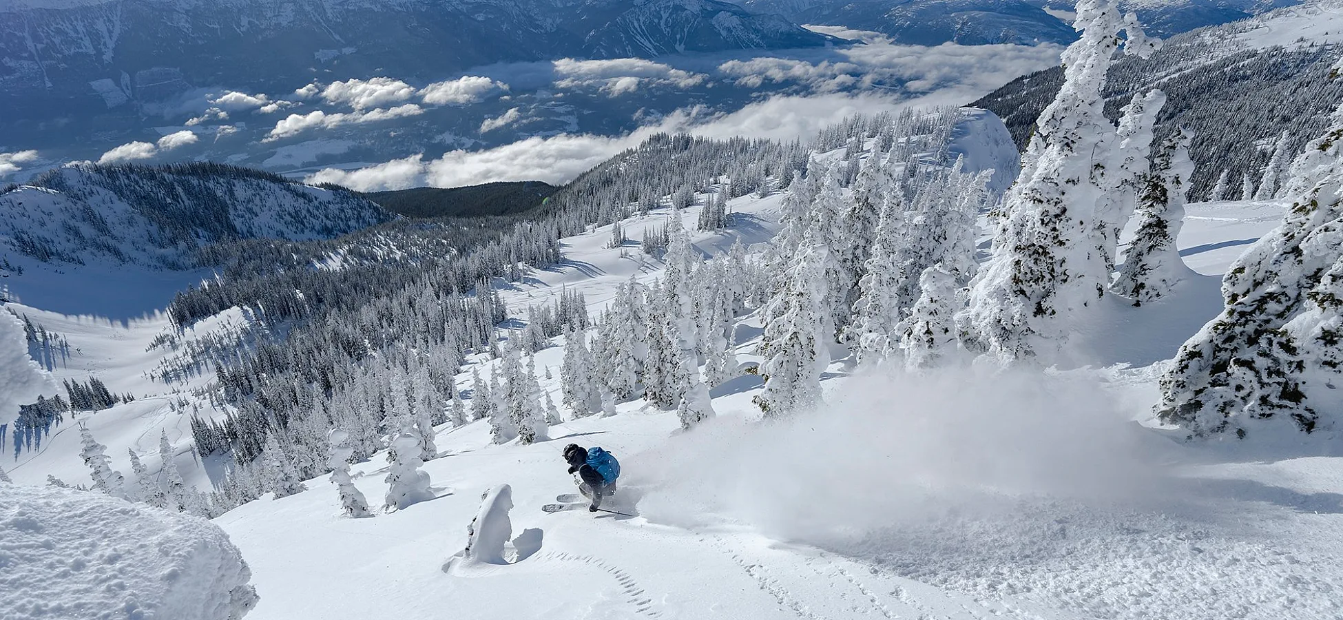 A person skiing down a snowy mountain