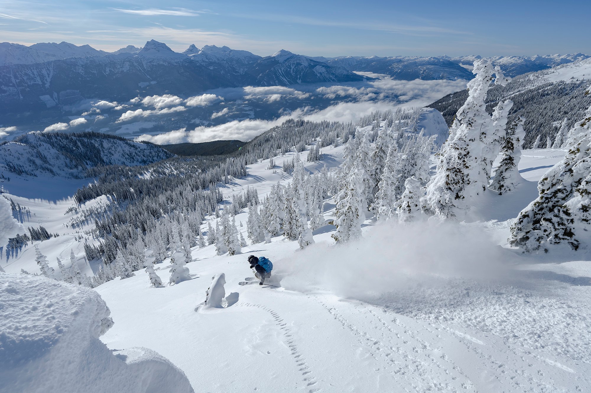 A person skiing down a snowy mountain