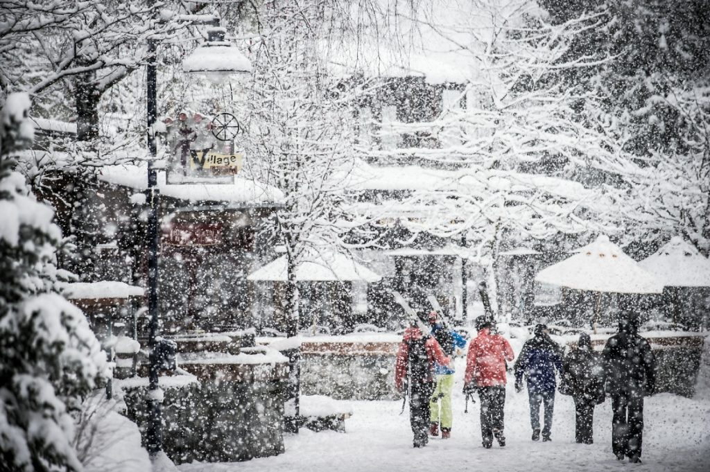 People walking through a snow storm