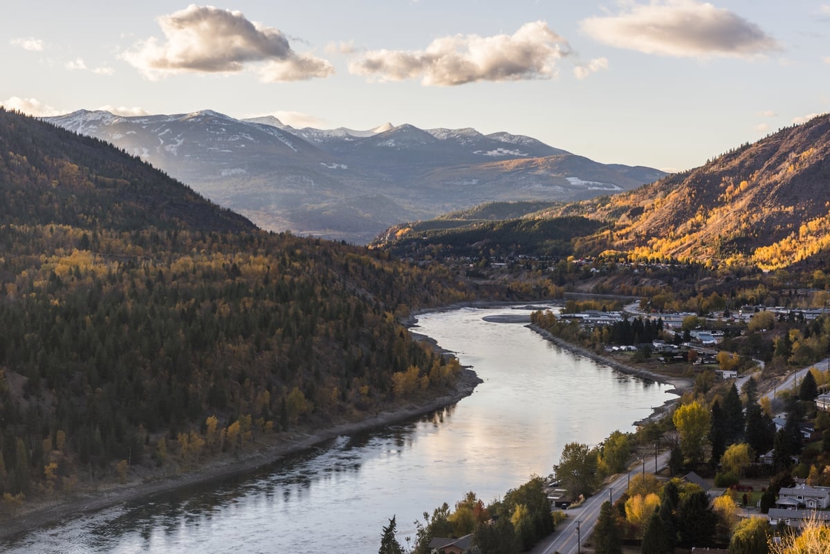 The Columbia River winds through the mountains as the sun sets