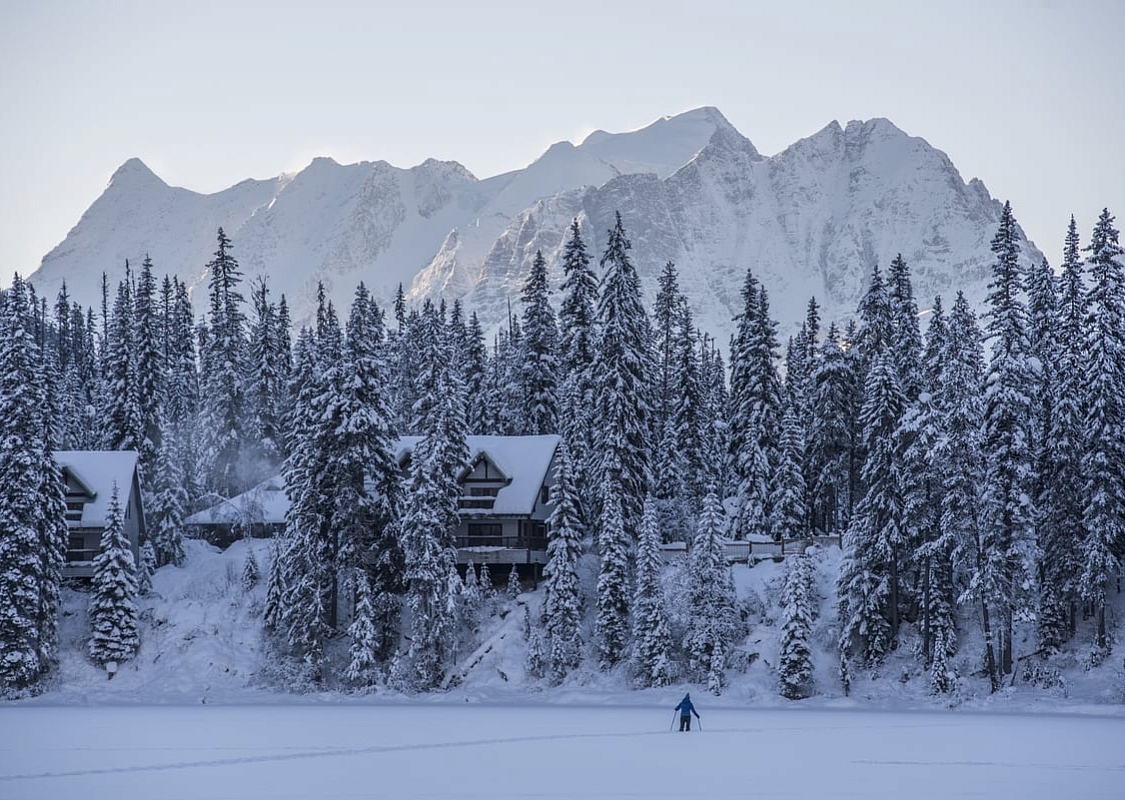 A snowshoer crosses Emerald Lake towards Emerald Lake Lodge in Yoho National Park | Keri Medig