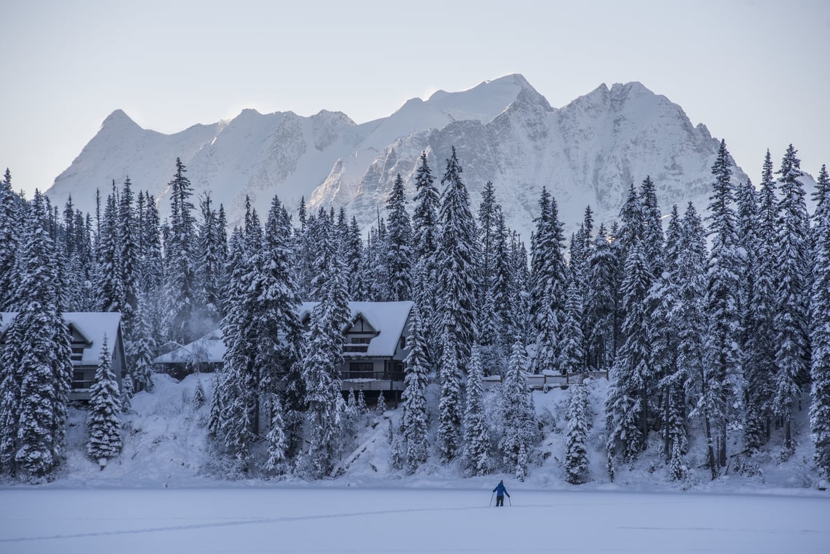 A snowshoer crosses Emerald Lake towards Emerald Lake Lodge in Yoho National Park | Keri Medig