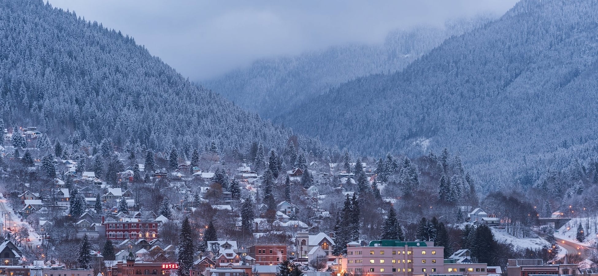 A view of Nelson at dusk from across Kootenay Lake | Kari Medig