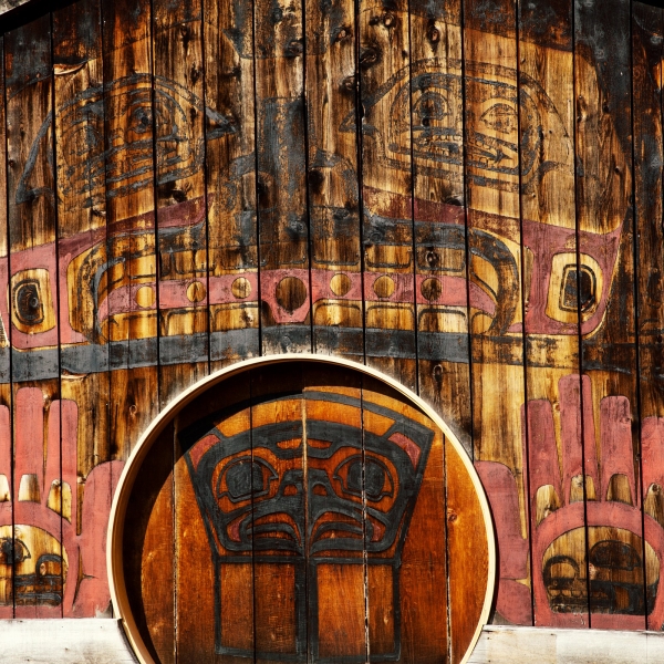The Gitlaxt'aamiks Interpretive Centre is a large long house with striking Nisga'a Nation artwork along the side and a circular door to enter.