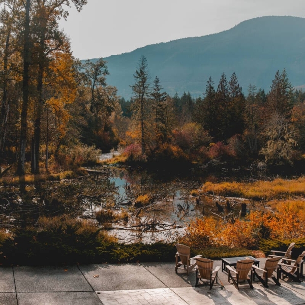 Outdoor seating on the Cowichan River at Cowichan River Lodge in Lake Cowichan.