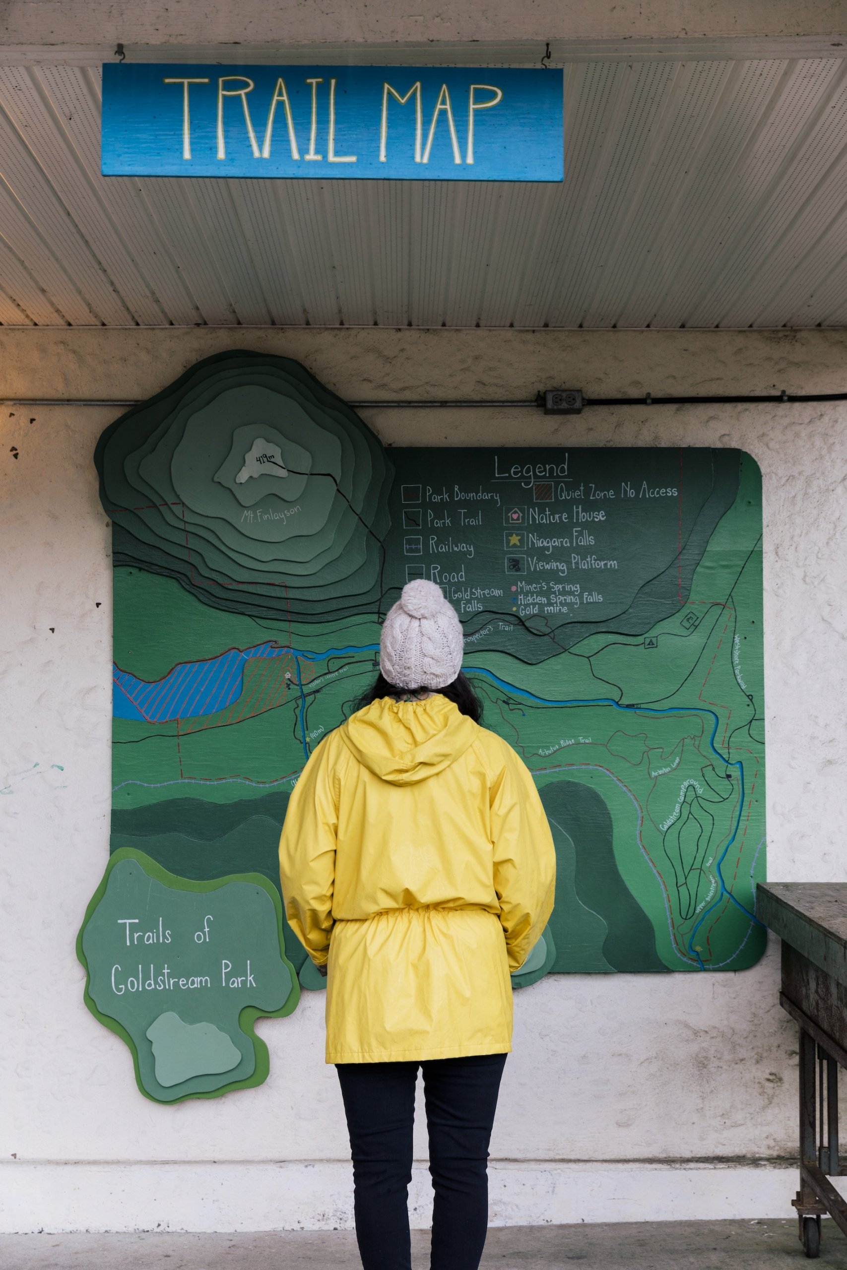 Person viewing the trail map at Goldstream Provincial Park