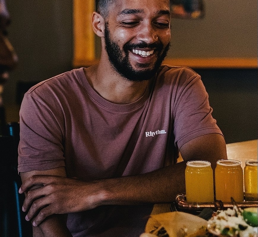 Two people enjoying food and beer at Iron Road Brewing in Kamloops | Jordan Dyck