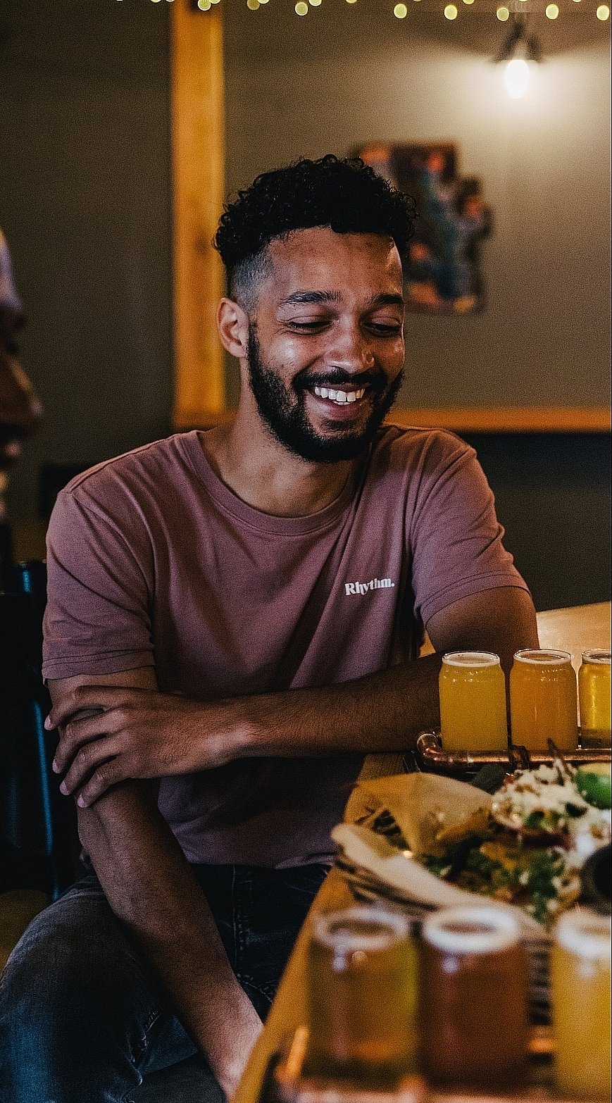 Two people enjoying food and beer at Iron Road Brewing in Kamloops | Jordan Dyck