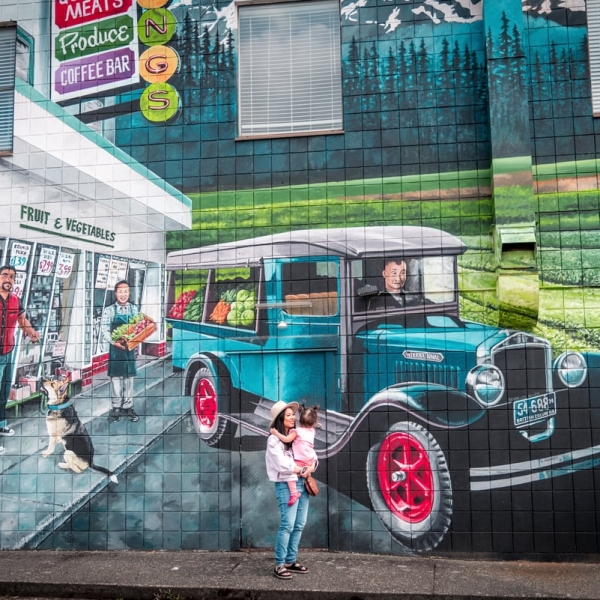 Yvonna Chow and daughter, Adelina, admiring a mural in downtown Courtenay