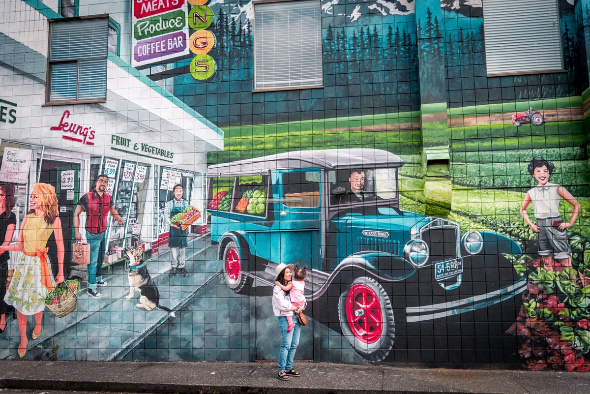 Yvonna Chow and daughter, Adelina, admiring a mural in downtown Courtenay