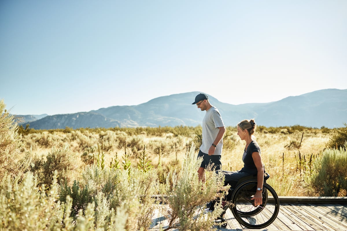 A couple is on the boardwalk at the Desert Centre.