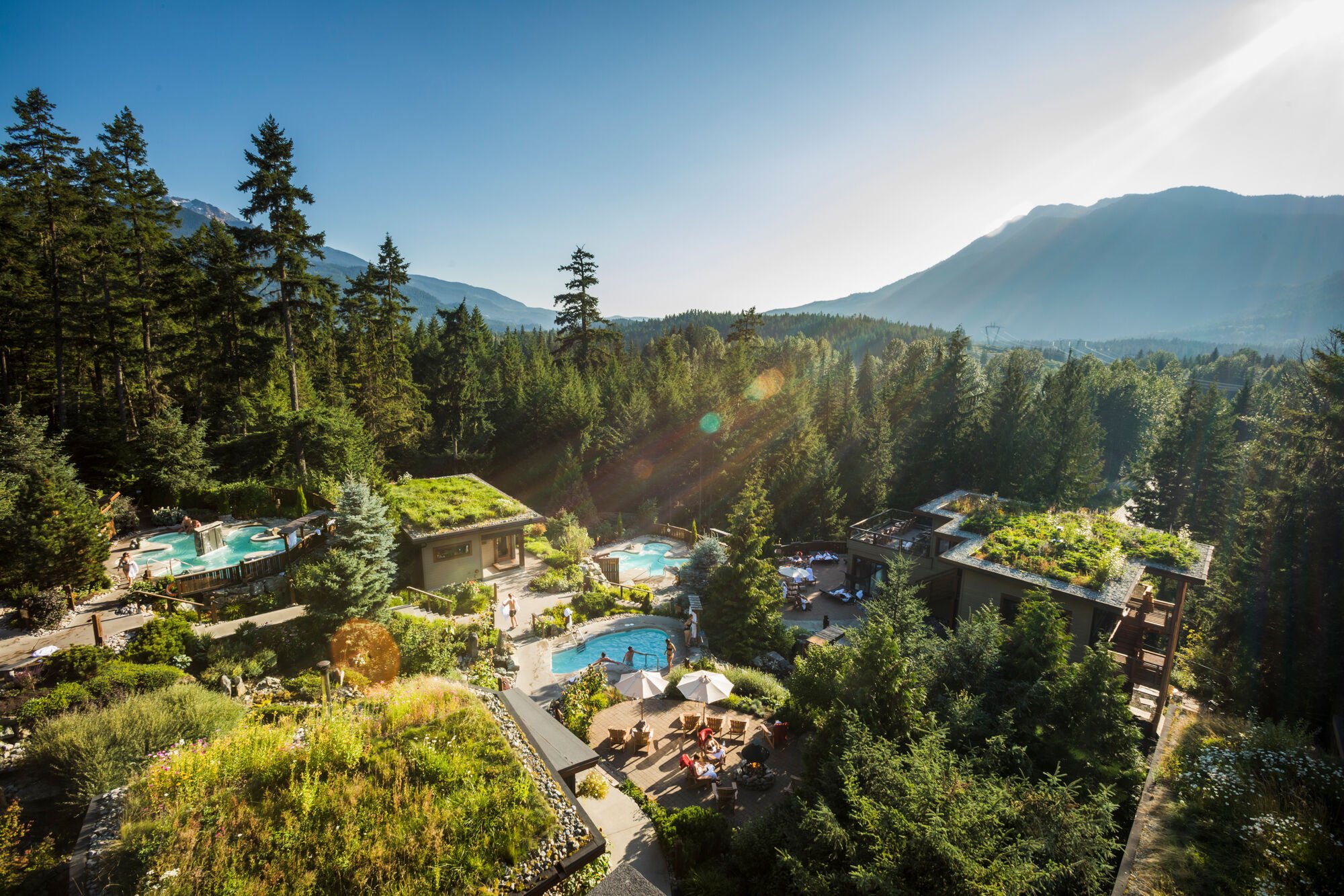 An aerial view of lush greenery and pools at the Scandinave Spa.
