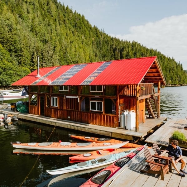 A wooden house on the dock at the Khutzeymateen Lodge