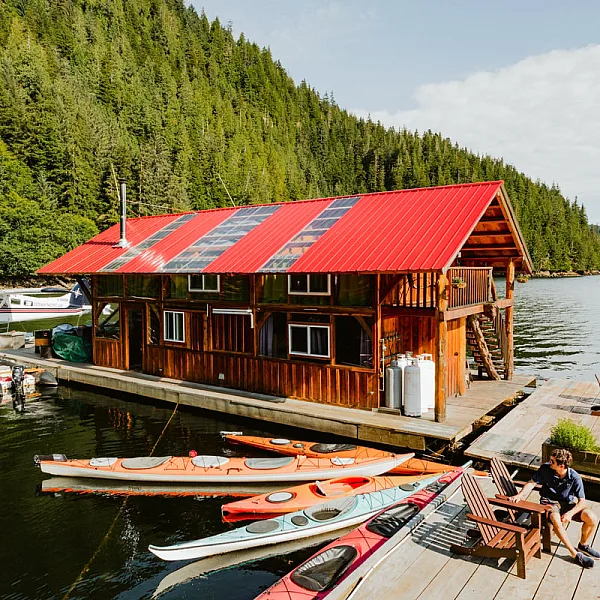 A wooden house on the dock at the Khutzeymateen Lodge