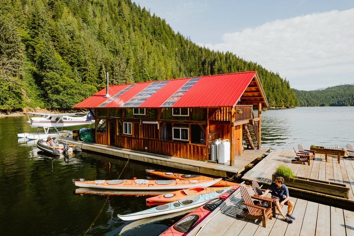 A wooden house on the dock at the Khutzeymateen Lodge
