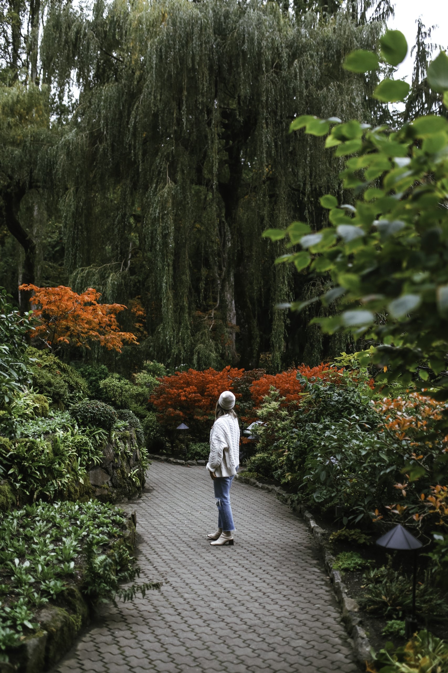 A person standing in a garden