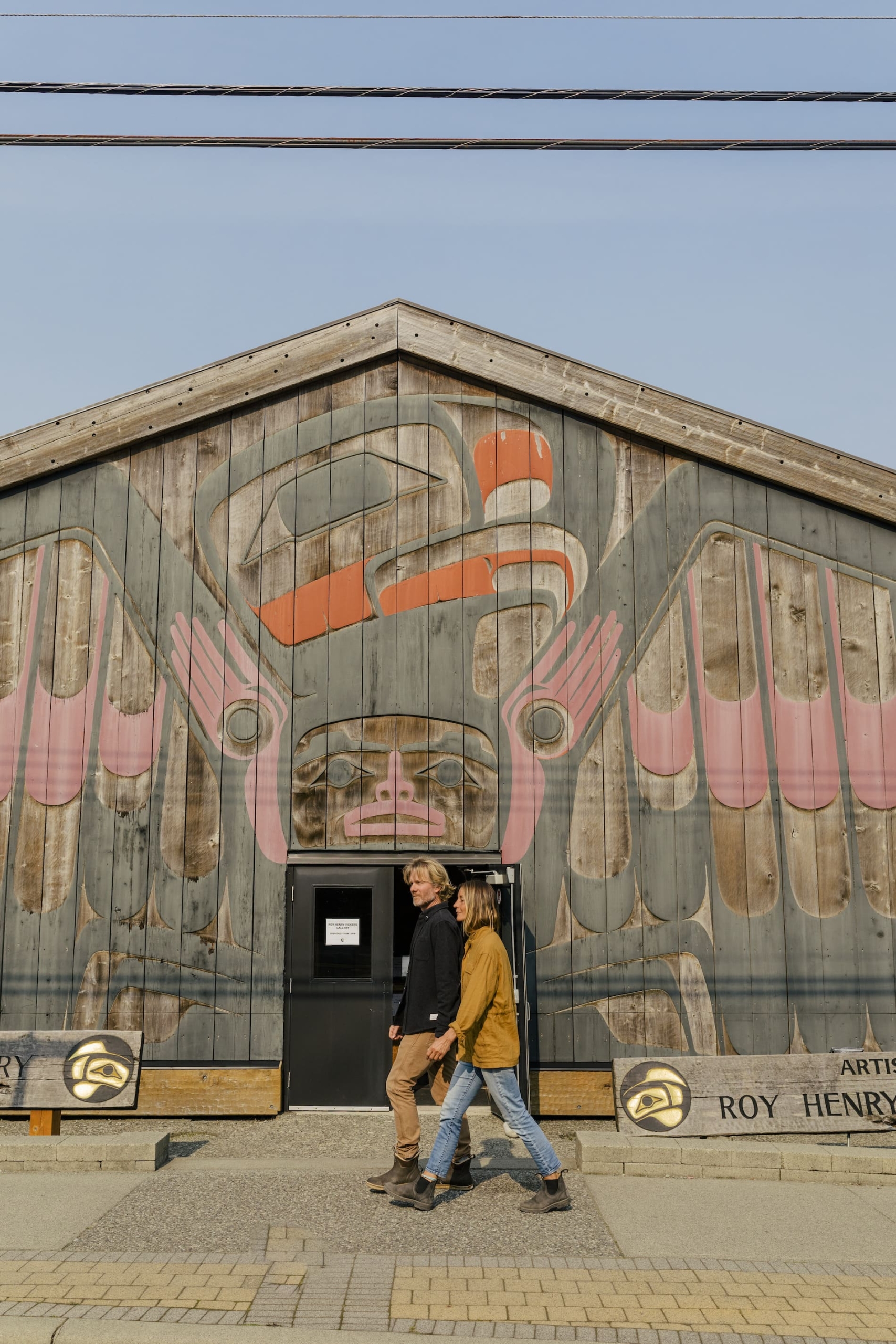 Two people visiting the Roy Henry Vickers Gallery in Tofino.
