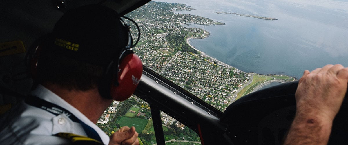 Aerial shot from inside a plane looking down at Victoria below