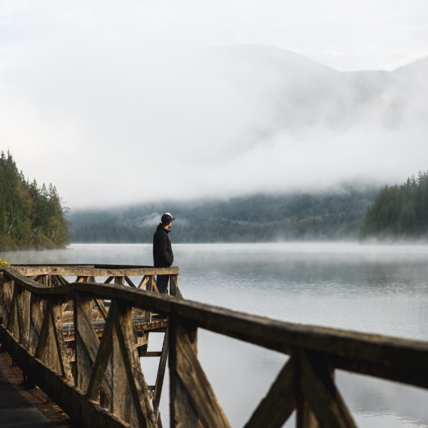 A contemplative moment on a misty morning along the Sunshine Coast Trail in Inland Lake Provincial Park, BC.