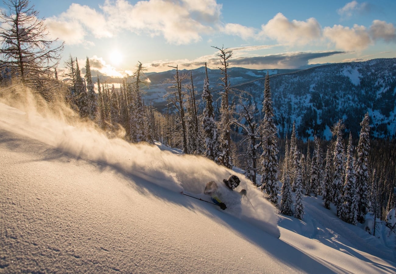 Skiing through powder at Whitewater Ski Resort