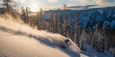 Skiing through powder at Whitewater Ski Resort