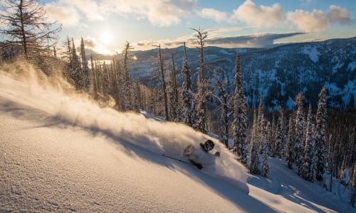 Skiing through powder at Whitewater Ski Resort