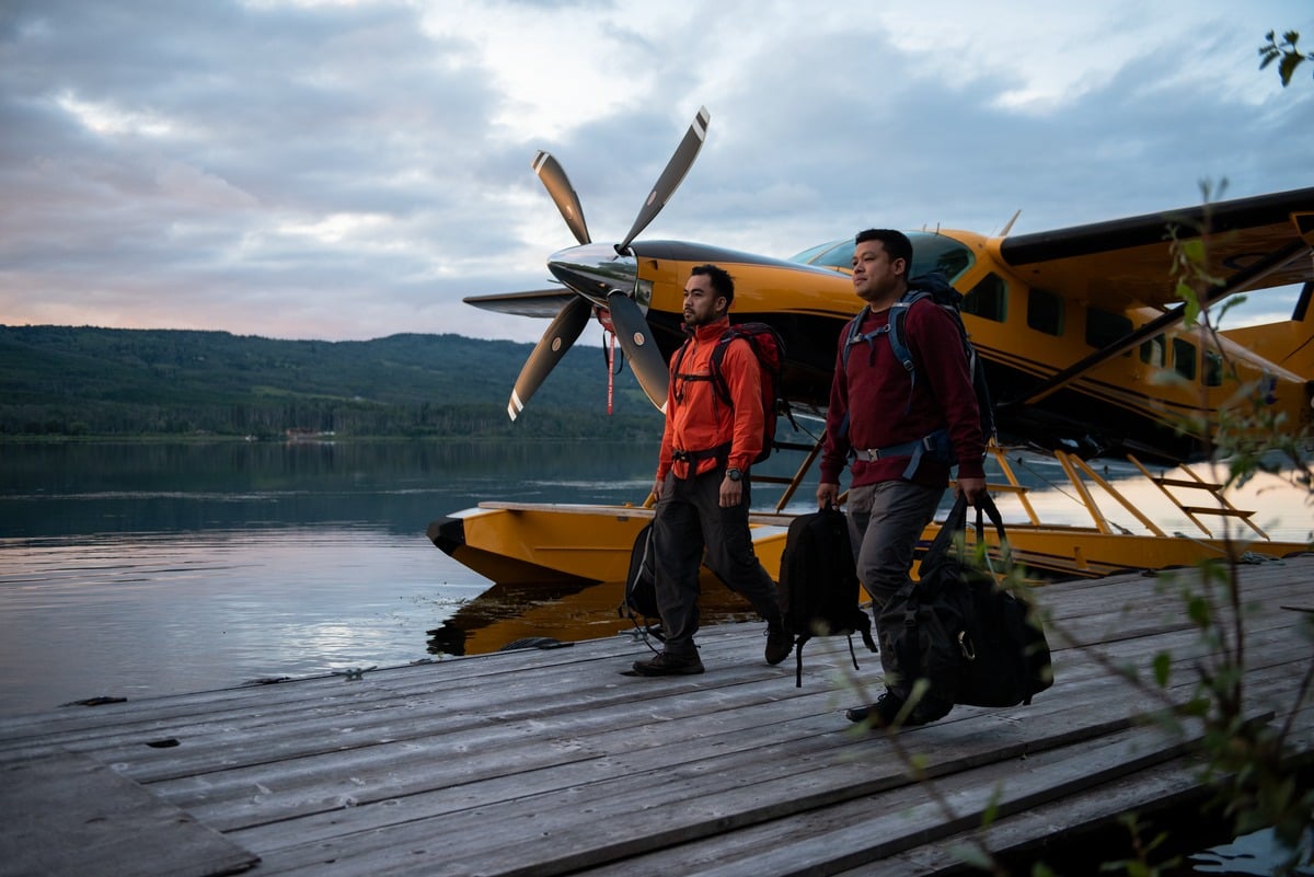 Friends walking on the dock of Alpine Lakes Air in Telkwa | 6ix Sigma
