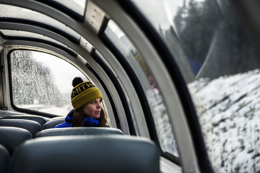 A woman sitting on a train