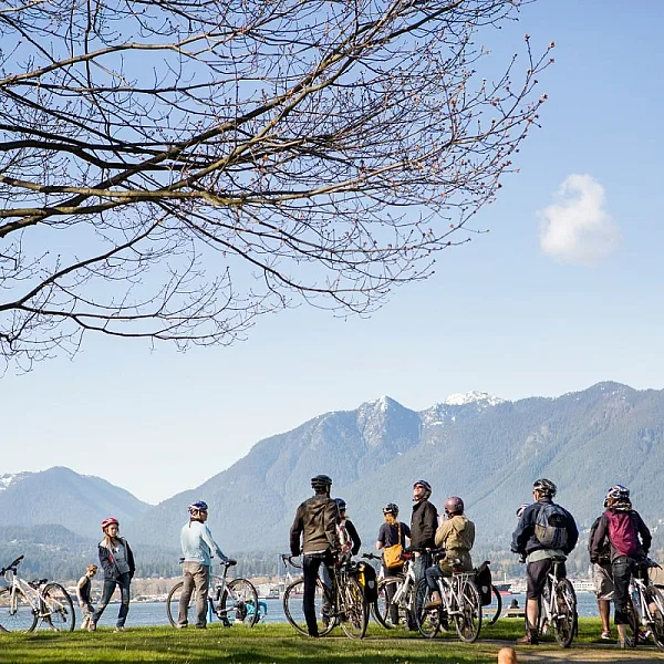 Cycling in Vancouver with North Shore Mountains in the backdrop |