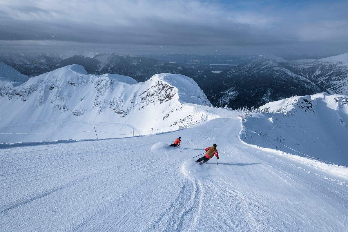 A duo of skiers downhill skiing at Fernie Alpine Resort.