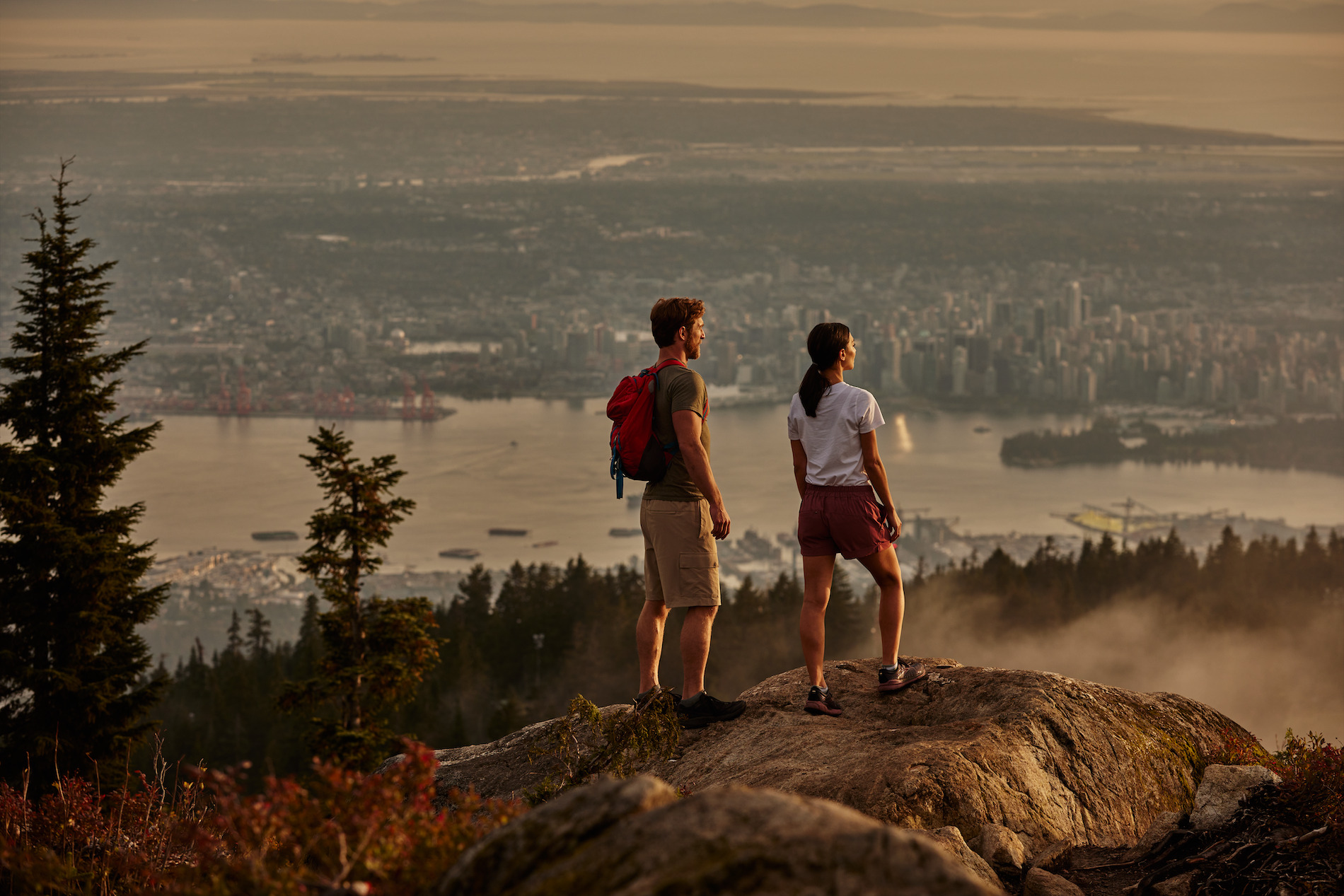 Two people overlooking a city