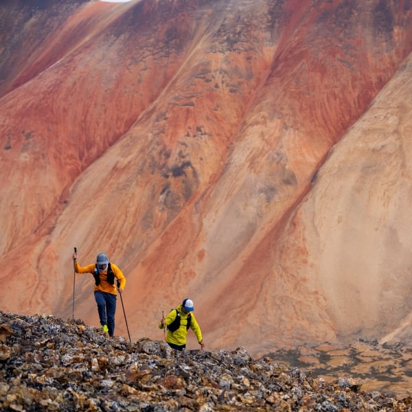 Hikers / trail runners in the Spectrum Range, Mount Edziza Provincial Park.