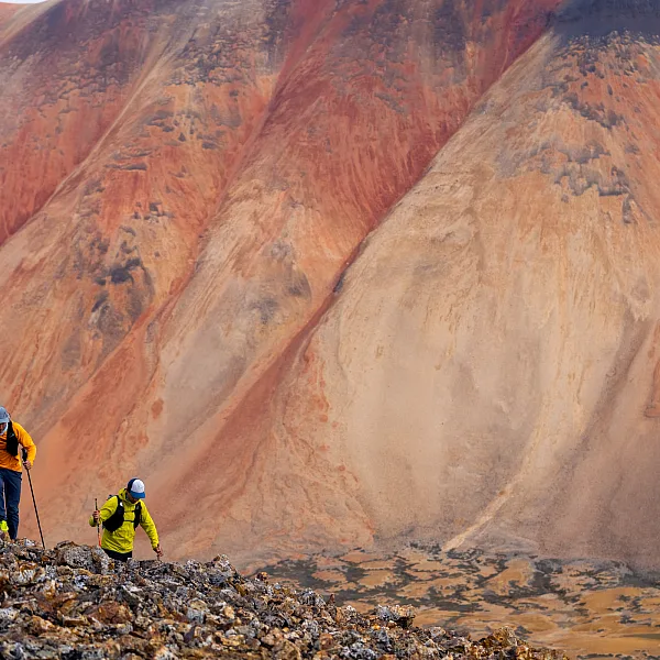 Hikers / trail runners in the Spectrum Range, Mount Edziza Provincial Park.