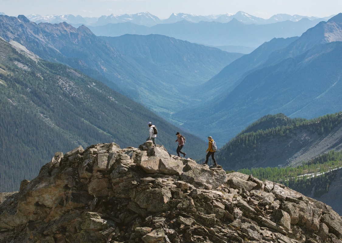 Three friends heli-hiking in the Bugaboos during a guided trip with CMH Bugaboos.
