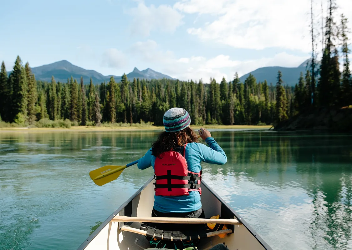 Canoer paddling along the Bowron Lake Provincial Park