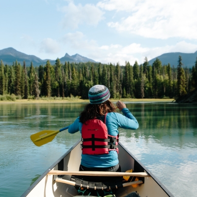 Canoer paddling along the Bowron Lake Provincial Park