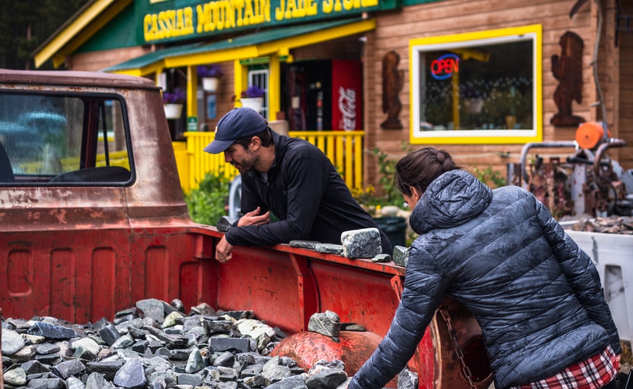 People sifting through an old truck for goodies at Jade City in Northern BC.