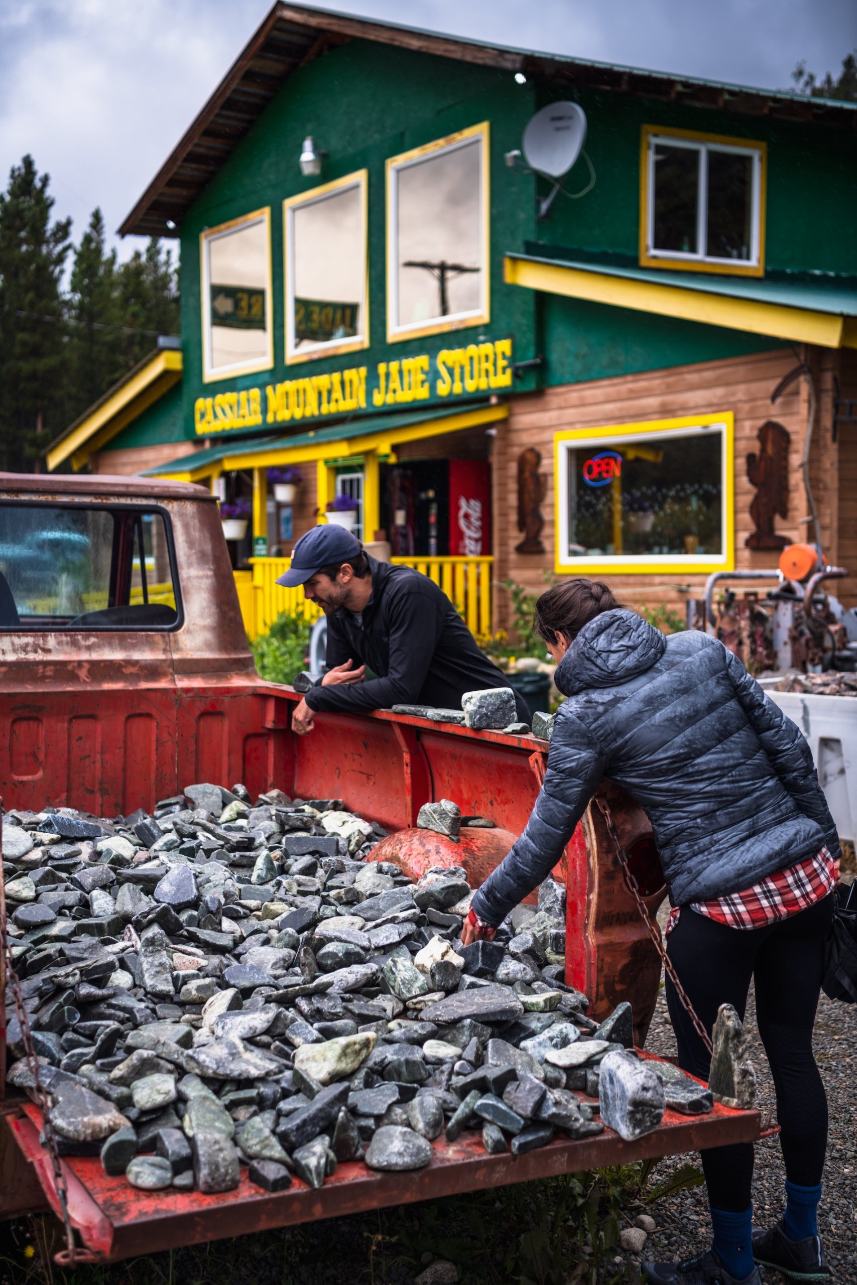 People sifting through an old truck for goodies at Jade City in Northern BC.