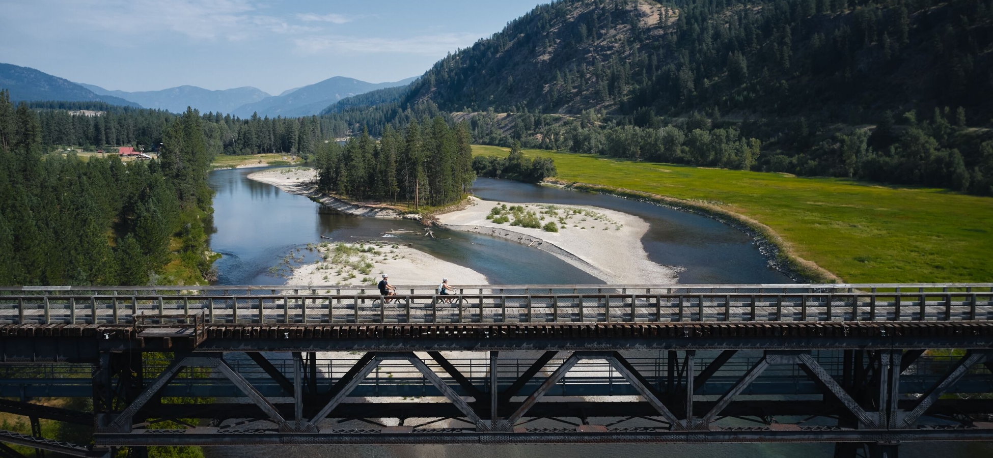 Biking on a trestle bridge on the Kettle Valley Trail in Christina Lake