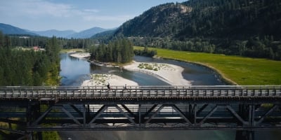 Biking on a trestle bridge on the Kettle Valley Trail in Christina Lake