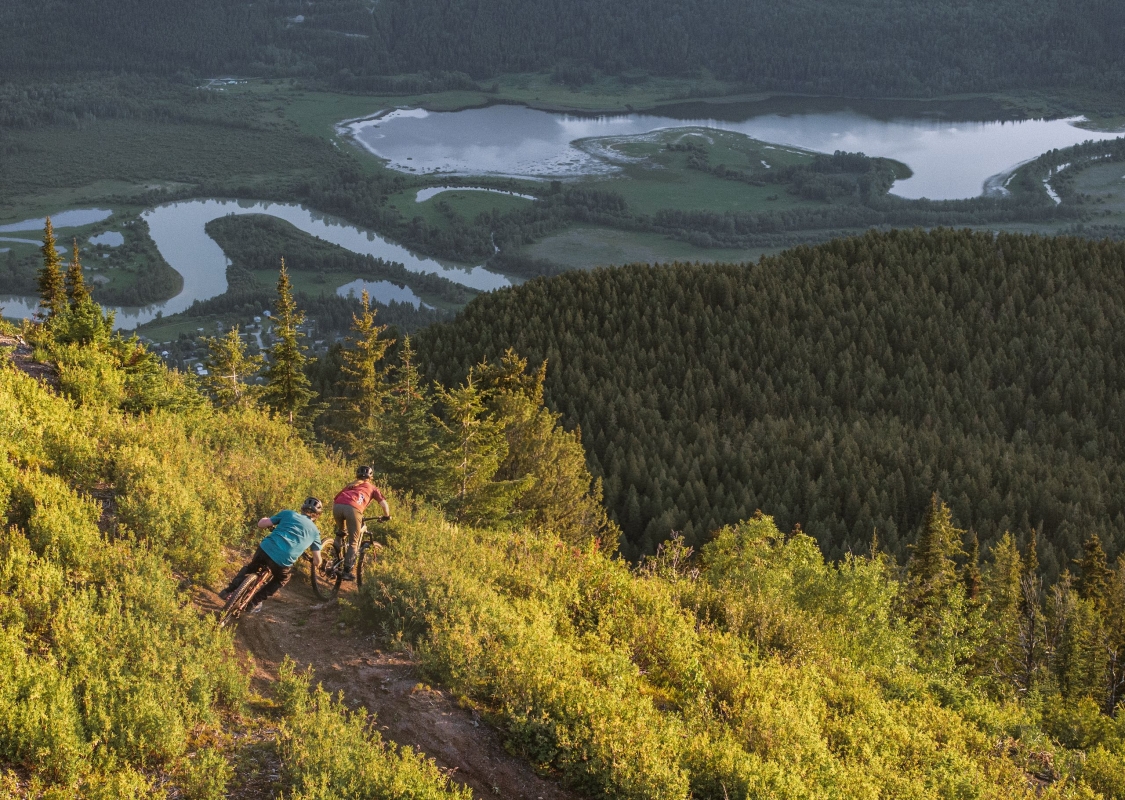 Two friends biking down Mount 7, Golden's hotspot for downhill biking.
