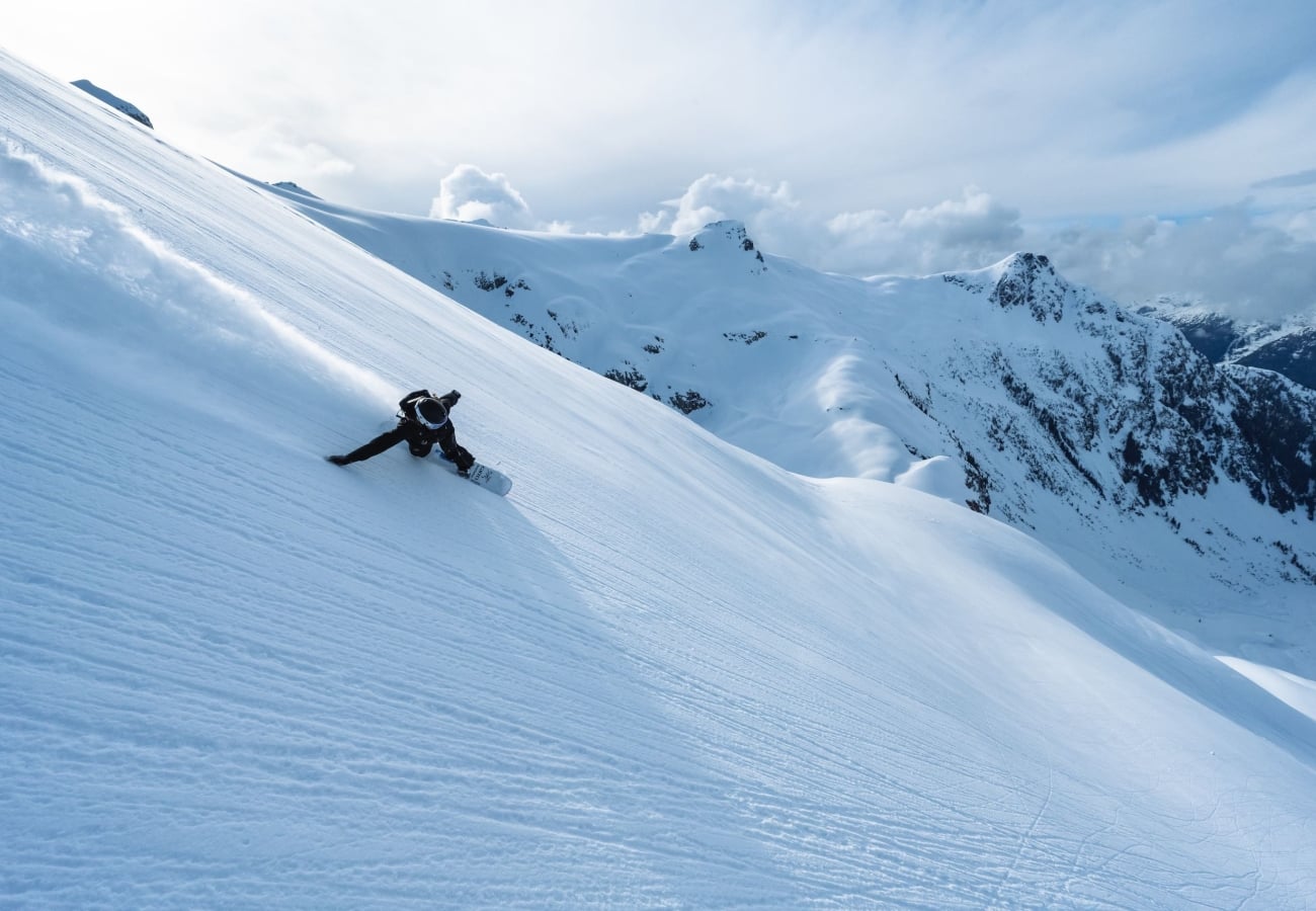 A snowboarder on a hill in British Columbia