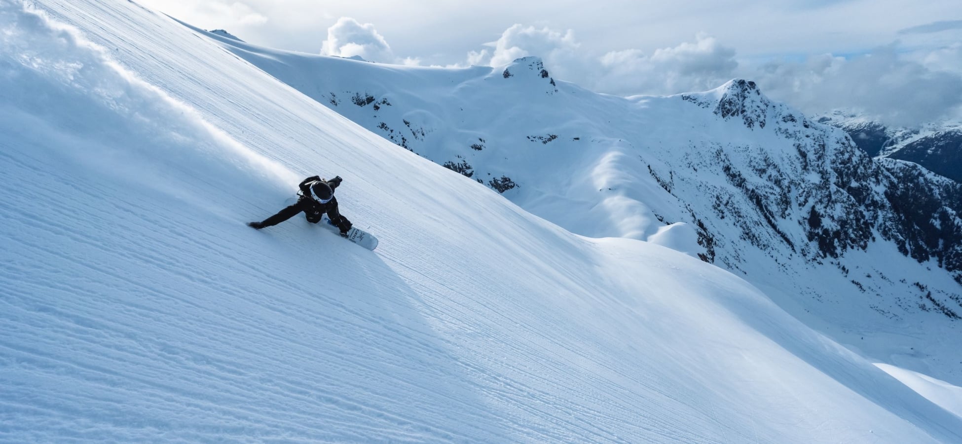 A snowboarder on a hill in British Columbia