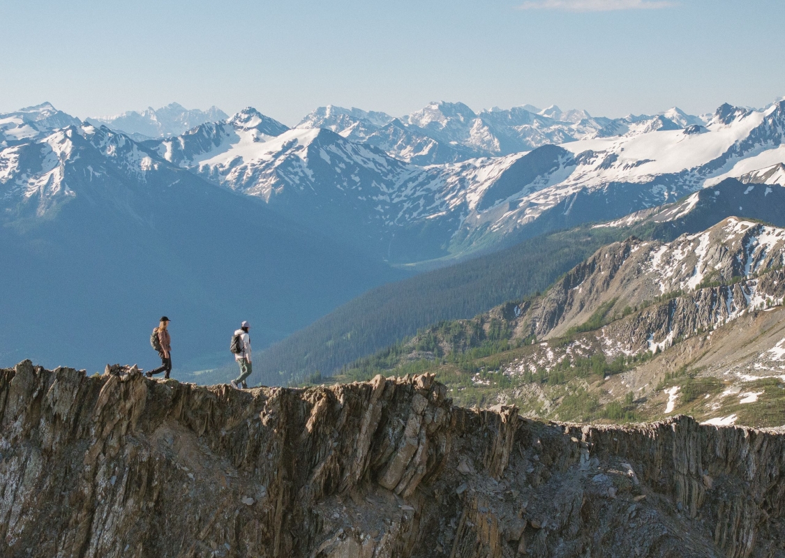 Two friends hiking alongside the glaciers and mountains of Bugaboo Provincial Park during a heli-hiking trip with CMH Bugaboos.